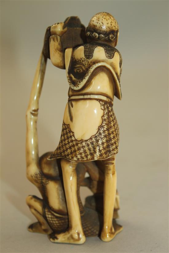 A Japanese ivory okimono of Ashinaga and Tenaga, Meiji period, 10.3cm